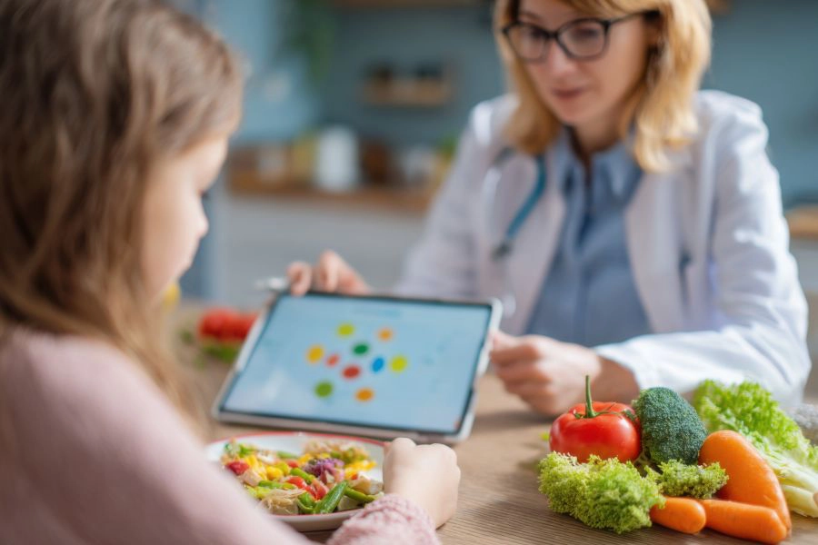 Professional Child Nutritionist Consulting Client with Balanced Diet Plan